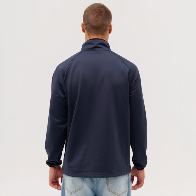 A navy jacket with a high collar, worn backwards by a person, featuring a logo on the back.