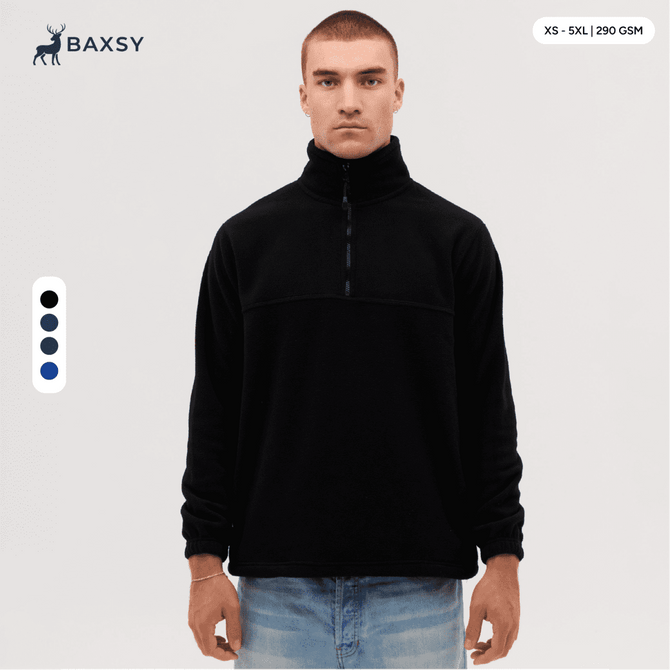 A black polar fleece 1/4 zip jacket displayed on a model, featuring a high collar and a logo.