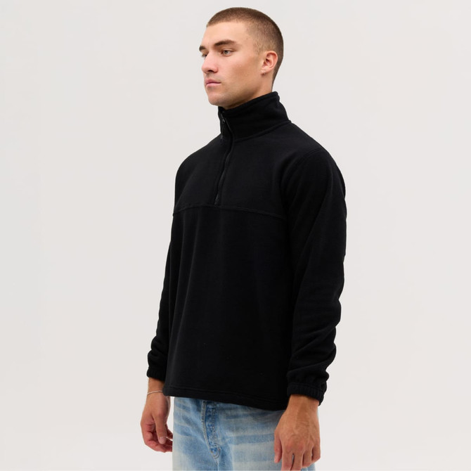 A side view of a black quarter-zip polar fleece top, featuring a stand-up collar and long sleeves.