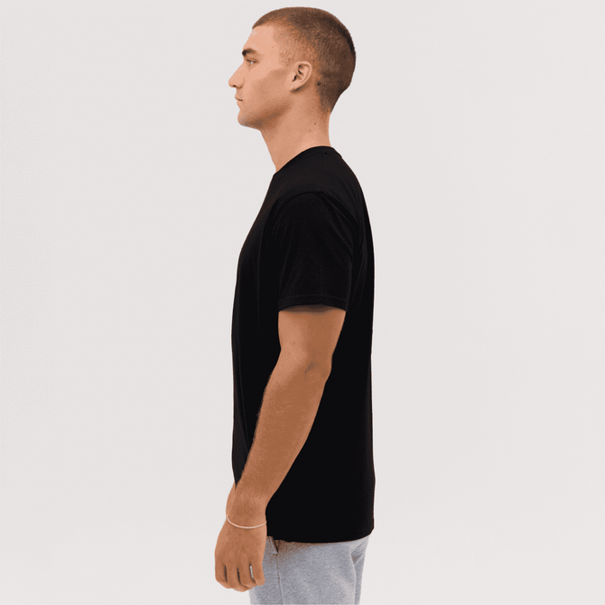 A black T-shirt displayed from the side, featuring a simple design and a logo on the shirt.