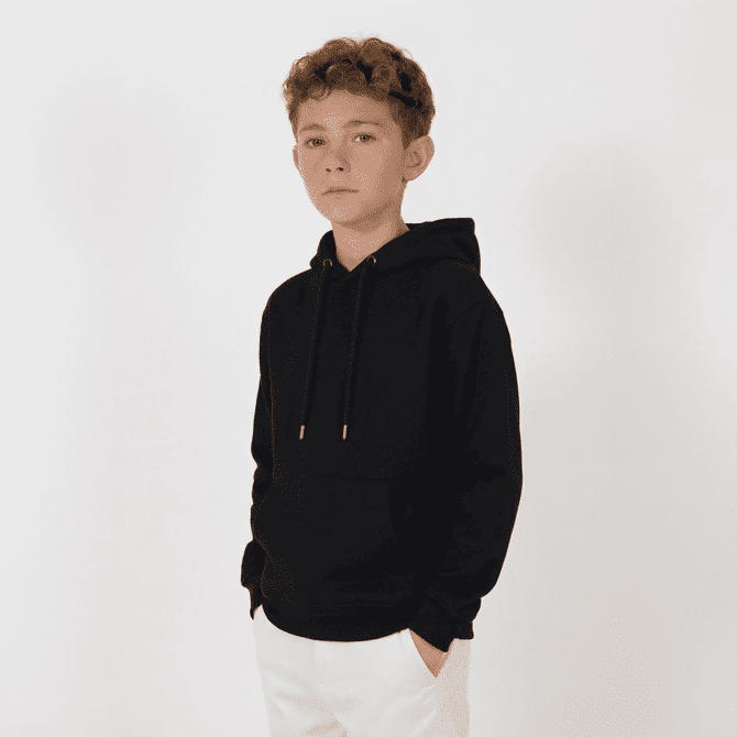 A black youth hoodie with a front pocket, featuring a hood and drawstrings, worn by a young boy.