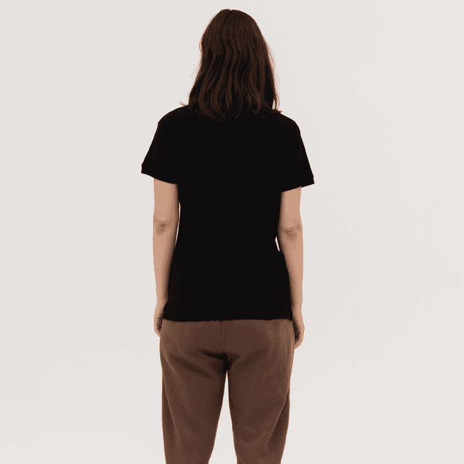 A black women's polo shirt is displayed from the back, featuring a simple design and a relaxed fit.