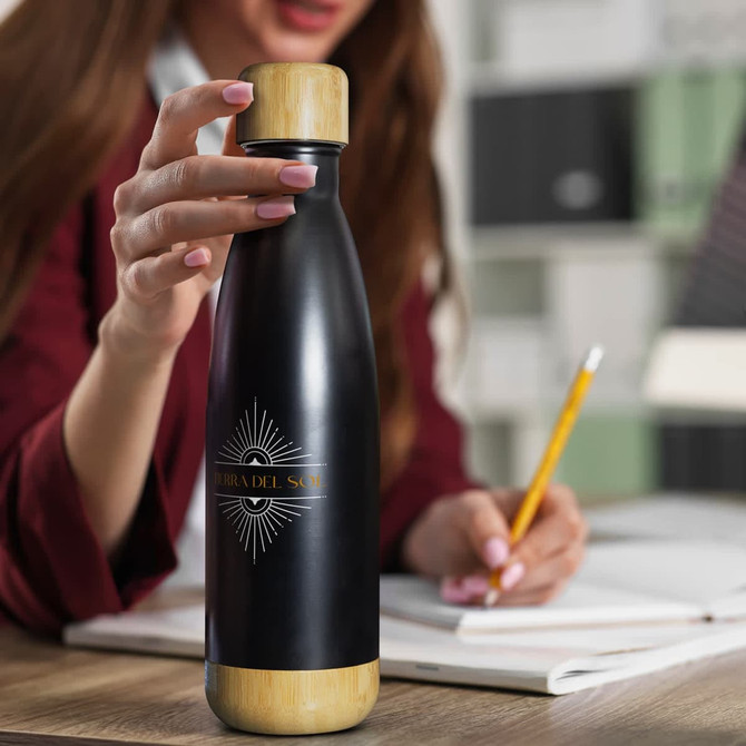 A drink bottle featuring a black body and bamboo accent, with a logo on the front.