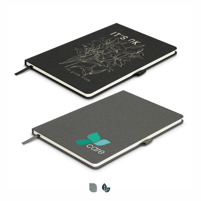 A black Petros Stone Paper Notebook with a design and a logo on the cover, featuring a ribbon bookmark.