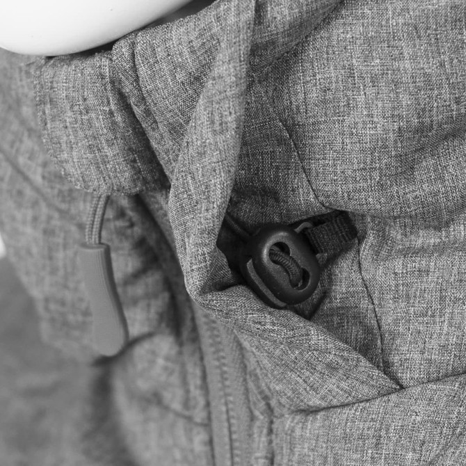 A grey puffer jacket featuring adjustable toggles and a textured fabric, with a logo present on the garment.