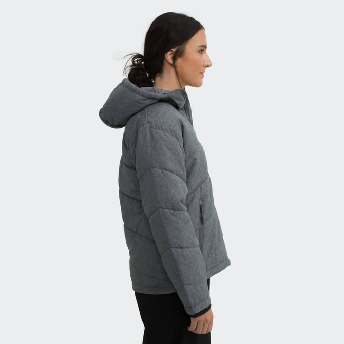 A woman is wearing a grey puffer jacket with a hood, showcasing a side profile view. The jacket features stitched detailing.
