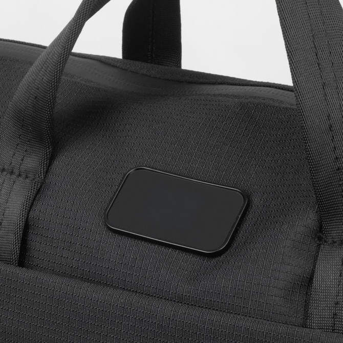 A black computer bag with sturdy handles and a branding logo on the front.