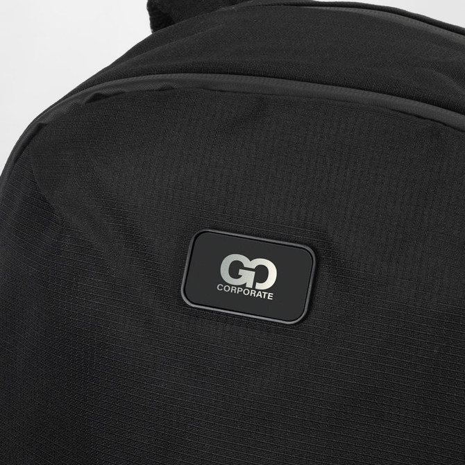 A black computer backpack featuring a textured fabric and a logo patch on the front.