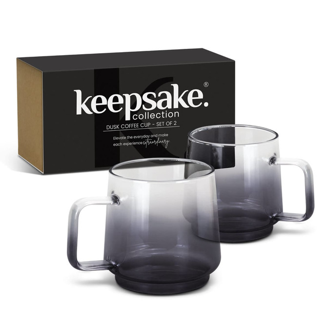 A set of two transparent grey coffee mugs in a black and brown box, featuring smooth handles.