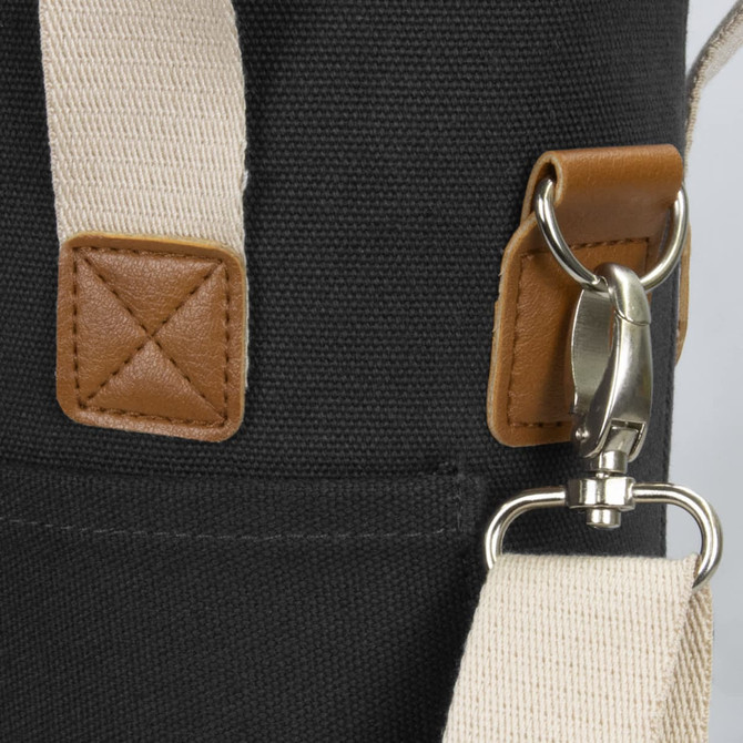 A wine cooler bag in dark fabric with a beige strap and leather accents, featuring a metal clip and stitching details.