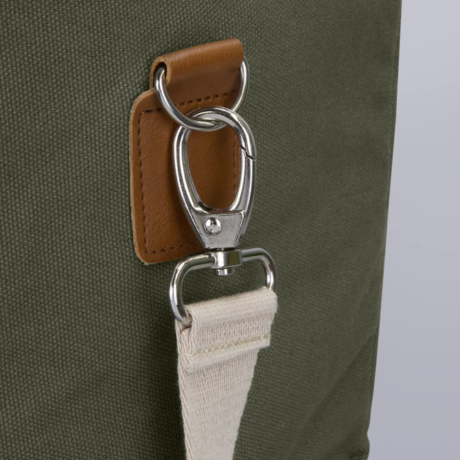 A green cooler bag featuring a metal clip and a beige strap attachment. It includes a leather accent.