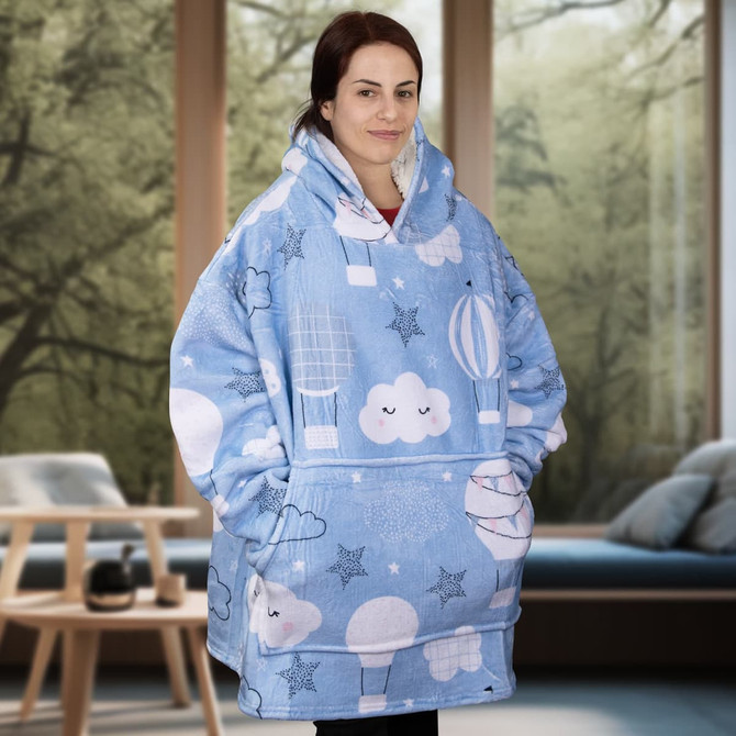 A blue blanket hoodie featuring cloud and balloon patterns, with a spacious, oversized design and a logo.