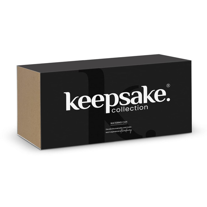 A black and brown box with 'keepsake' branding, containing a watering can from the Keepsake collection.