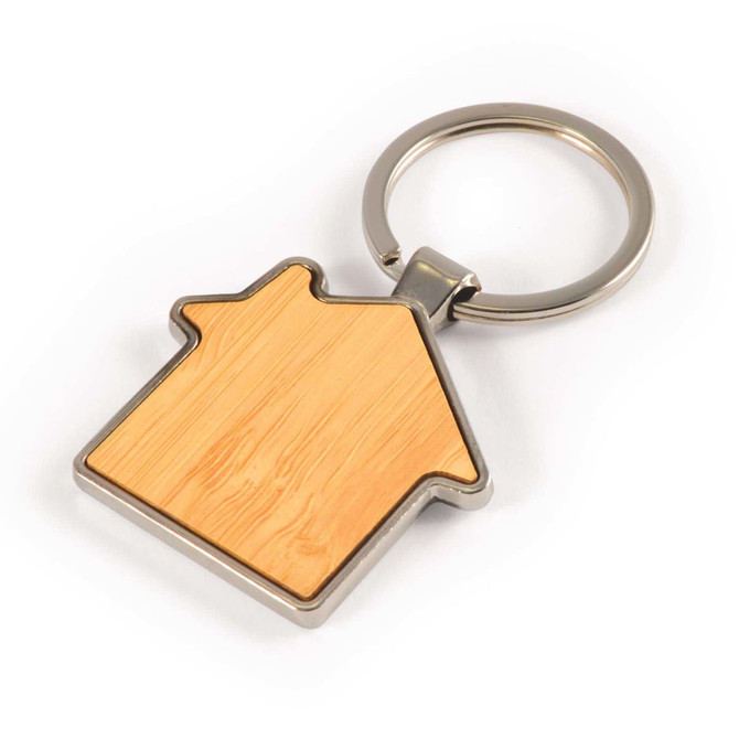 A house-shaped keytag made of bamboo with a zinc metal frame and a keyring attachment.