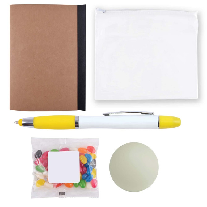 A brown notebook, a white pouch, a yellow and white pen, a container of colorful jelly beans, and a green stress ball.
