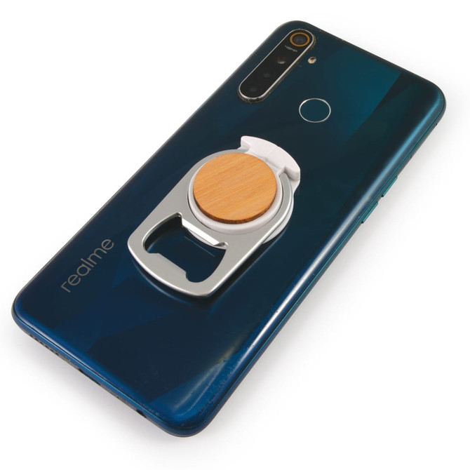 A drink bottle opener integrated into a phone stand, featuring a wooden accent, attached to the back of a smartphone.