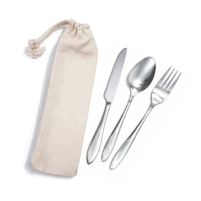 A banquet cutlery set in a beige calico pouch, featuring a knife, fork, and spoon.