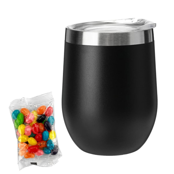 A black coffee cup with a stainless steel lid next to a bag of colourful jelly beans.