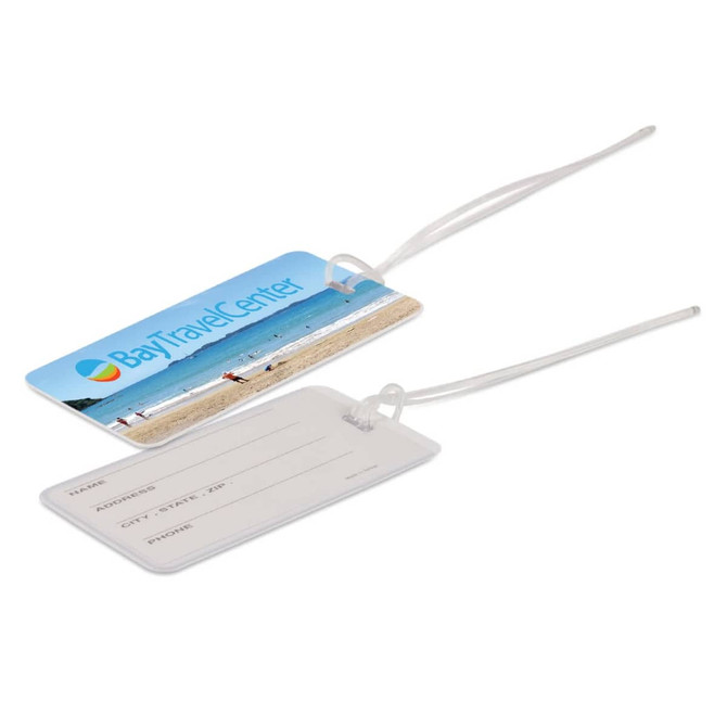 A luggage tag featuring a beach scene on one side and blank fields for name, address, and contact details on the other.