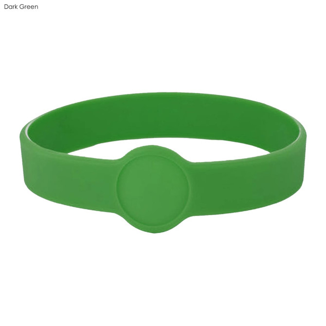 A dark green silicone wristband featuring a circular design element and a smooth finish.