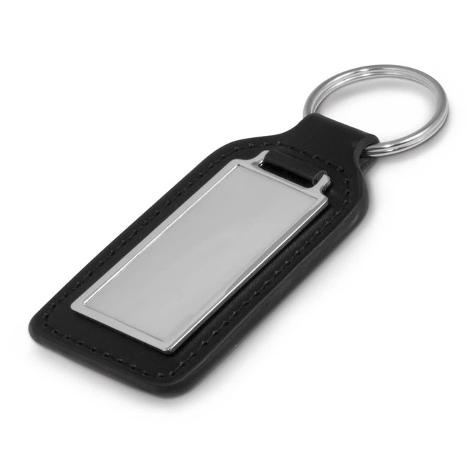 A rectangular leather key ring featuring a metal plate for personalization, complete with a circular keyring attachment.