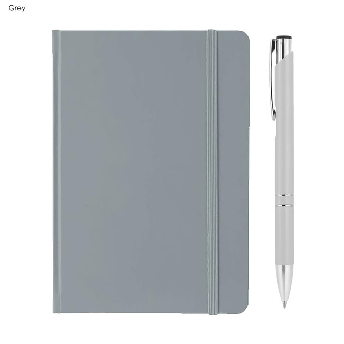 A grey A5 notebook with a matching elastic band and a silver pen beside it. The notebook features a logo on the cover.