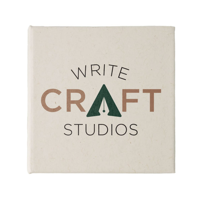 A square note block featuring a beige cover with a logo and text in dark green and brown.