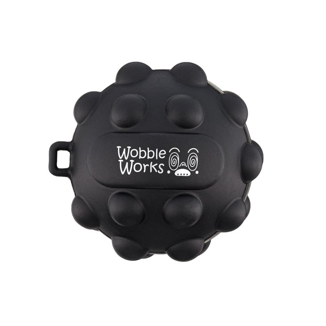 A black, round toy featuring raised bumps and a logo, designed with playful character details.