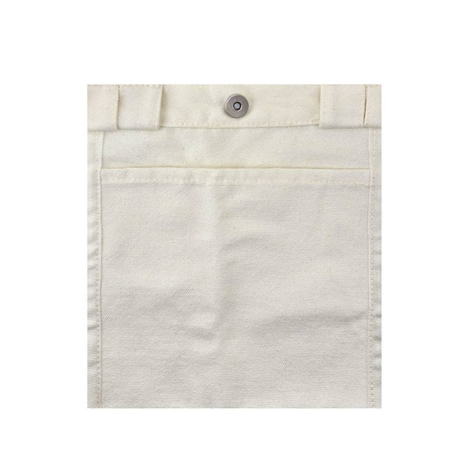 A cream-coloured canvas bag featuring a front pocket and a metal snap closure. It has a logo on it.