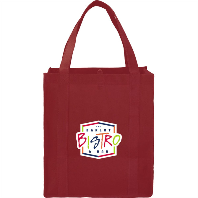 A red non-woven grocery tote bag with sturdy straps and a logo on the front.