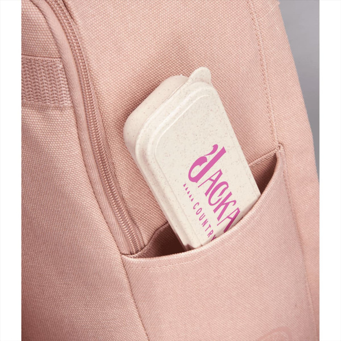 A bamboo fibre cutlery set in a beige case with a pink logo, tucked into a pink bag pocket.