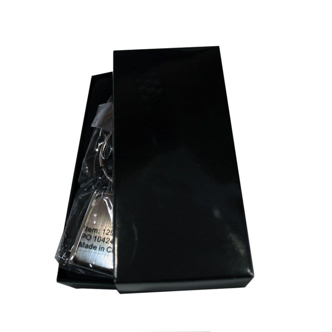 A rectangle keyring in a black box, featuring a sleek design. The packaging is glossy with a minimalist appearance.