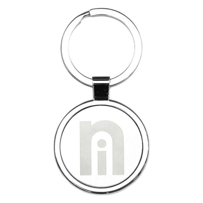 A silver metal keyring with a circular design and a logo in the centre.