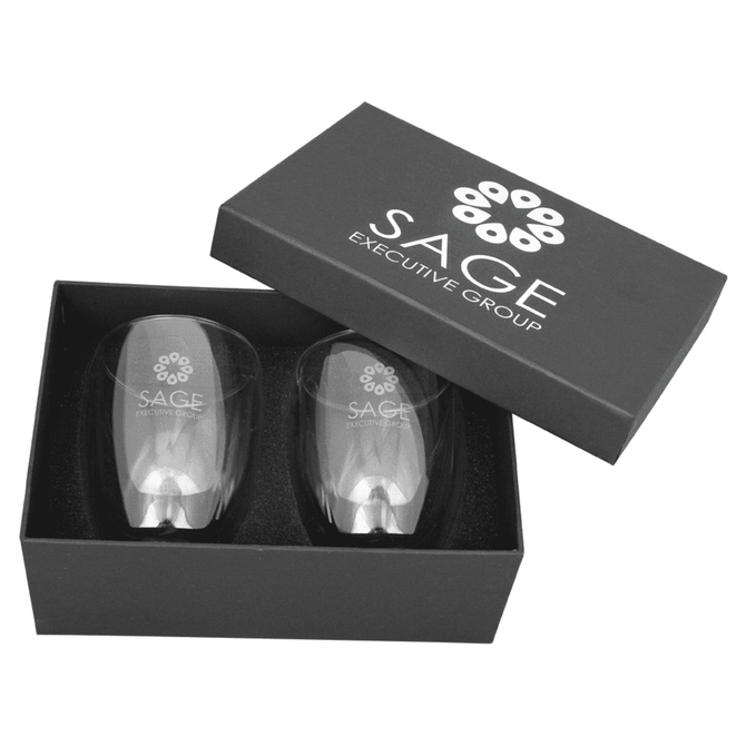 A glass coffee and tea set in a black gift box featuring a logo, with two clear glass cups inside.