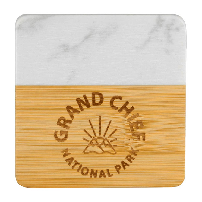 A marble and bamboo coaster featuring a logo and a smooth white marble top with a natural bamboo base.