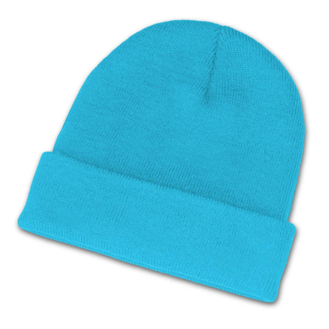 A bright turquoise beanie hat, featuring a ribbed cuff and a soft, textured fabric.