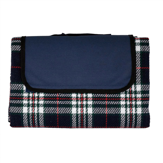 A picnic rug featuring a tartan pattern in navy blue, white, and red, with a solid navy flap and a branding logo.
