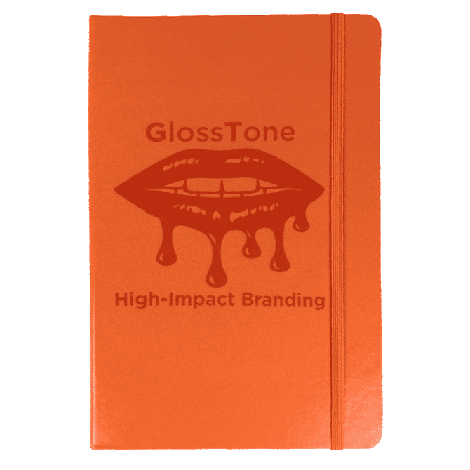 An orange journal with a textured cover and a logo, featuring an elastic band closure.