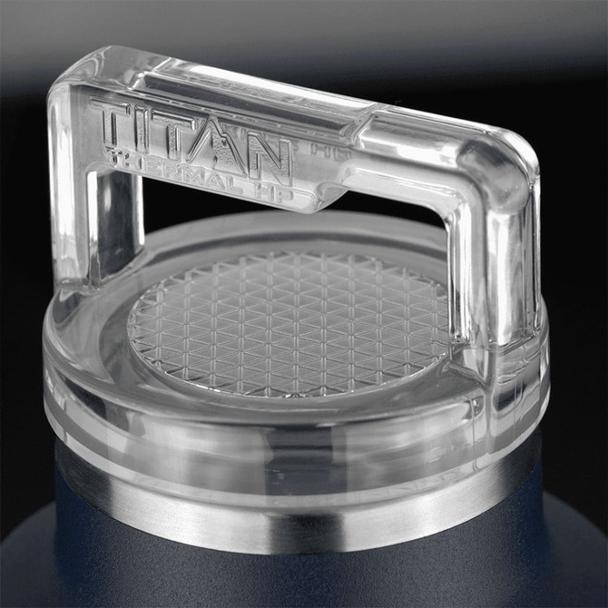 A drink bottle featuring a stainless steel base and a clear, hexagonal-patterned lid with a handle.