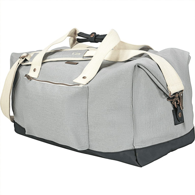 A grey cotton duffel bag with a darker base and cream straps, featuring a logo on the side.