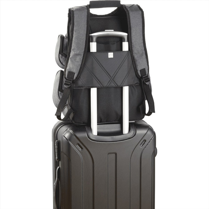 A grey backpack with multiple compartments sits atop a black suitcase, featuring a pull handle. It has visible branding.