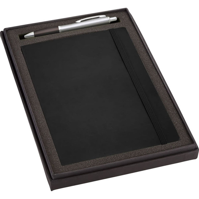 A black gift set featuring a journal and a silver pen, presented in a stylish black box with an insert.