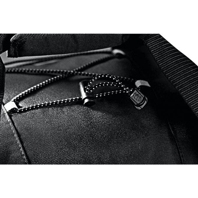 A close-up of a black wheeled duffel bag showcasing its zipper and bungee cord detail. The bag features branding.