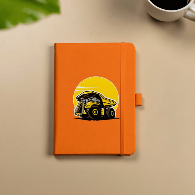 An orange hard-bound journal featuring an illustration of a dump truck, with an elastic closure.