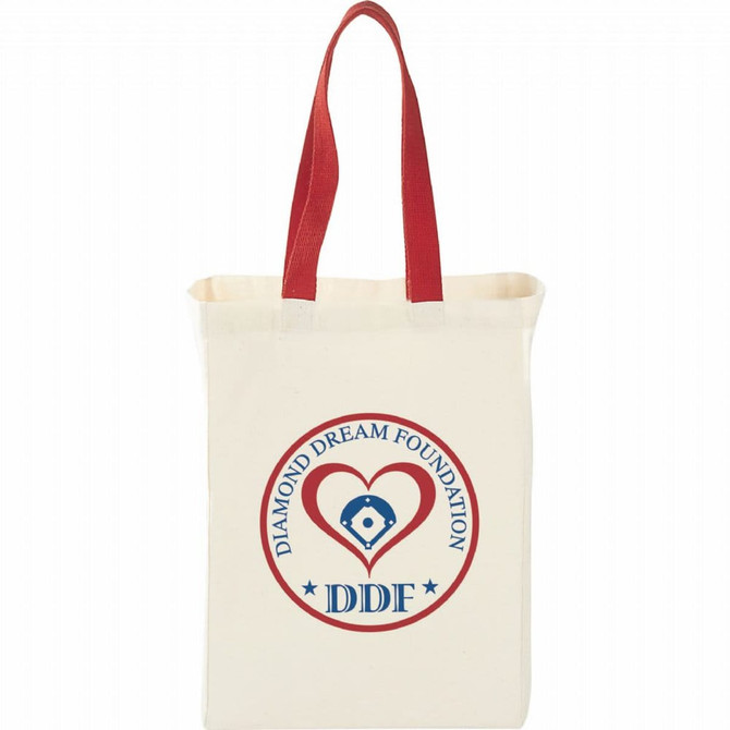 A natural cotton grocery tote bag in cream with red handles and a logo featuring a heart and text.