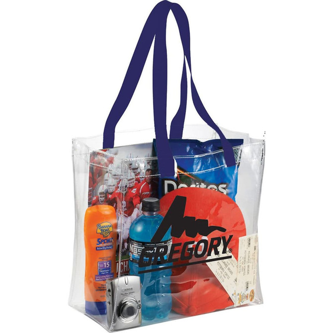Clear tote bag featuring blue handles, filled with a drink bottle, sunscreen, snacks, a cushion, and a camera.