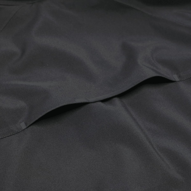 A black Oracle Softshell Jacket made from smooth fabric, featuring pockets and a subtle logo.