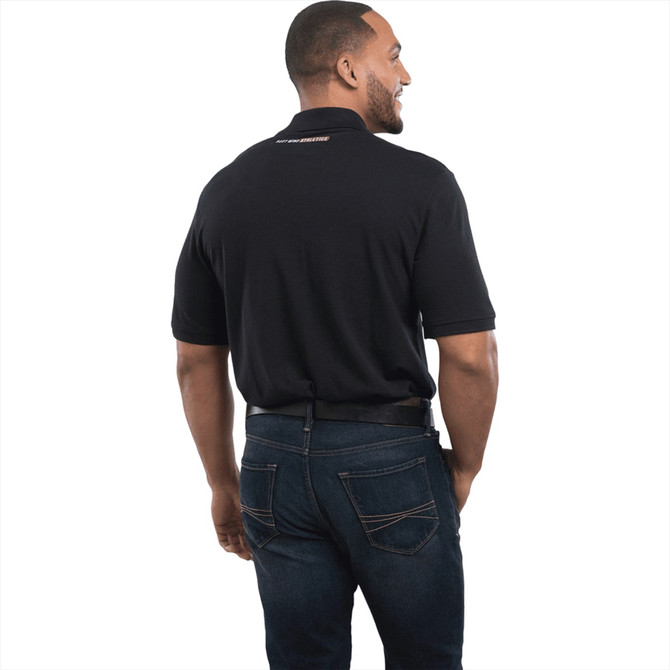 A man is wearing a black short sleeve polo shirt, viewed from the back, with a logo on the collar.
