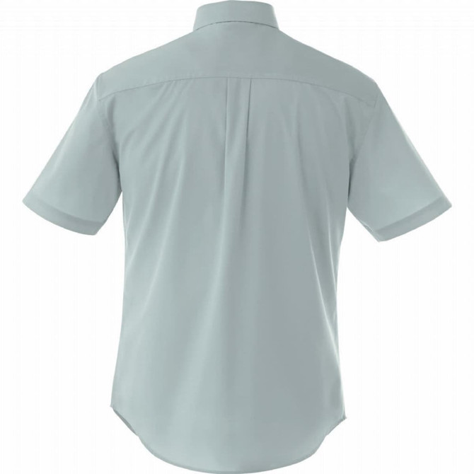 A short sleeve button-up shirt in a light green colour, featuring a back yoke and a collar. It has a logo.