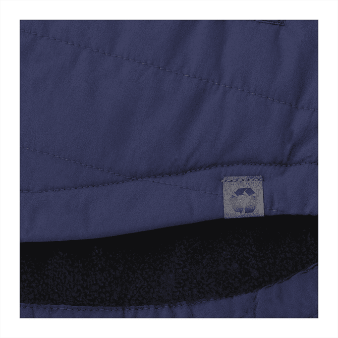 A navy insulated shacket featuring a silky exterior and a soft black lining, with a logo tag visible.